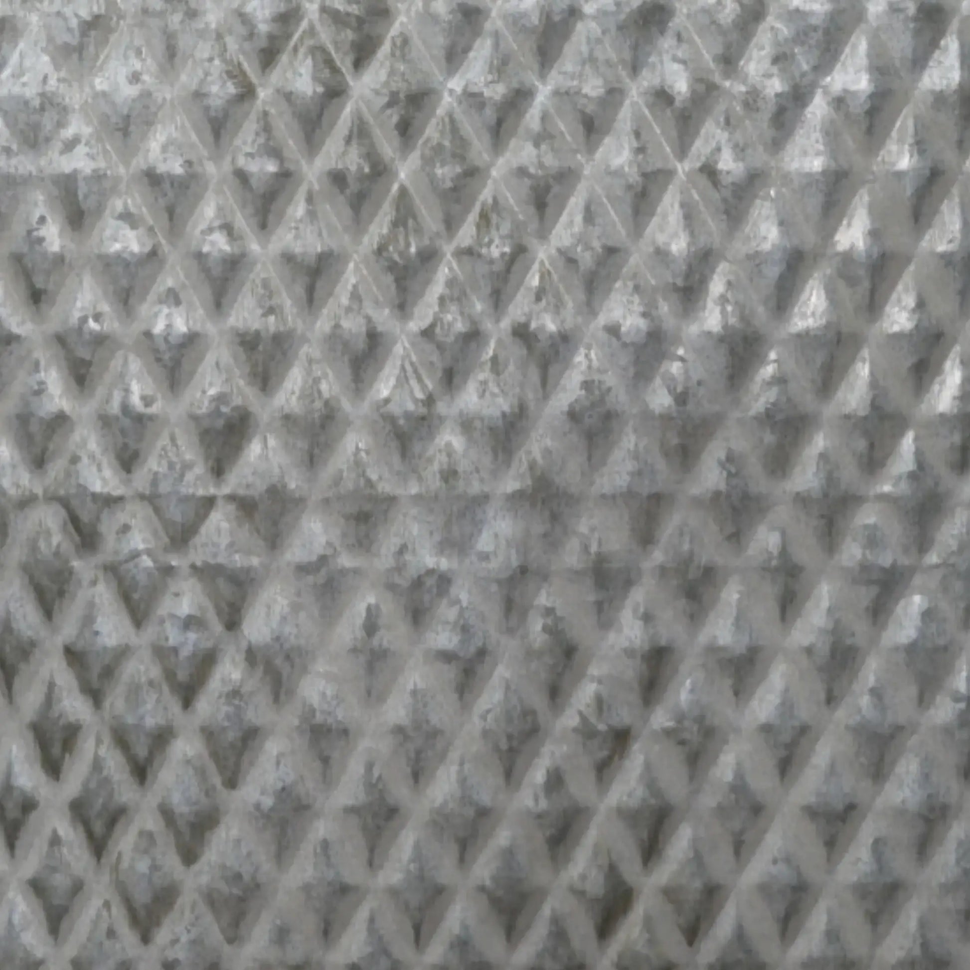 Close-up of a textured gray material with a diamond pattern