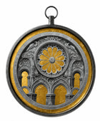 A circular pendant or medallion featuring a detailed gothic rose window design with gold and silver elements, complete with a hanging loop at the top, shown on a plain white background.