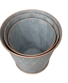 Set of three gray ceramic plant pots with copper rims on a white background