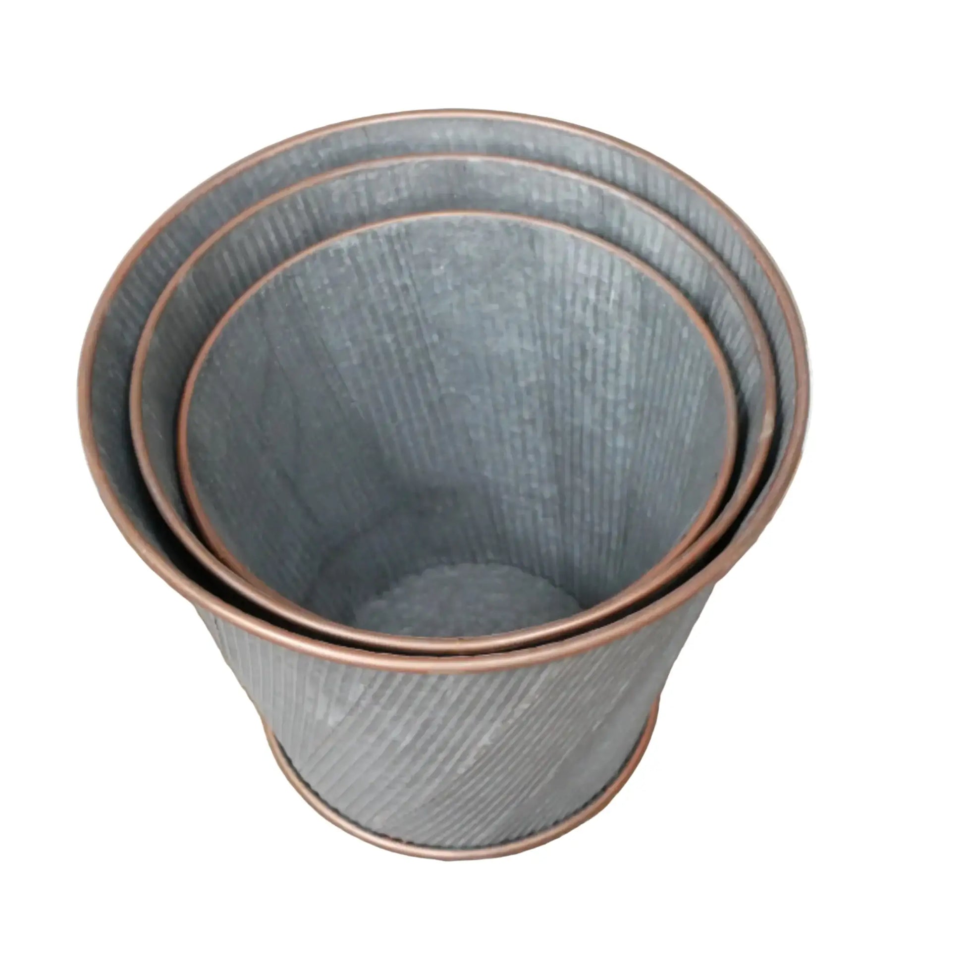 Set of three gray ceramic plant pots with copper rims on a white background