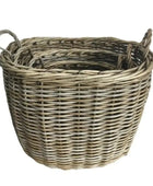 Wicker basket with handles on a white background