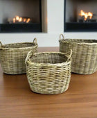 Three wicker baskets of different sizes on a white background