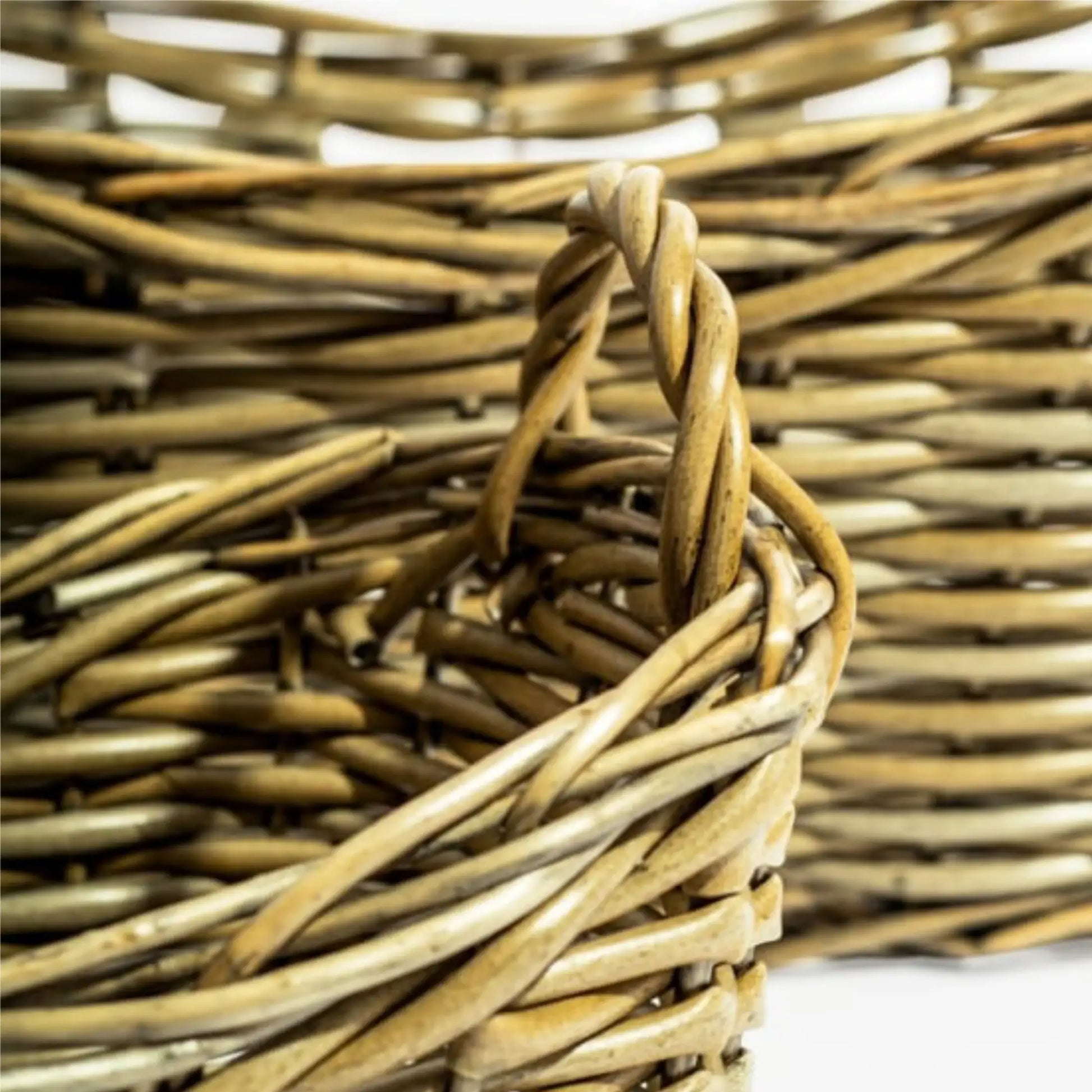 Close-up of a woven basket with a handle