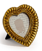 Gold decorative frame with a silhouette and text on a white background