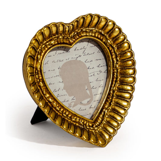 Gold decorative frame with a silhouette and text on a white background