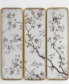 Three vertical rectangular wall panels with a gold-toned frame, featuring a delicate botanical branch and bird pattern in brown and muted tones on a distressed off-white background.