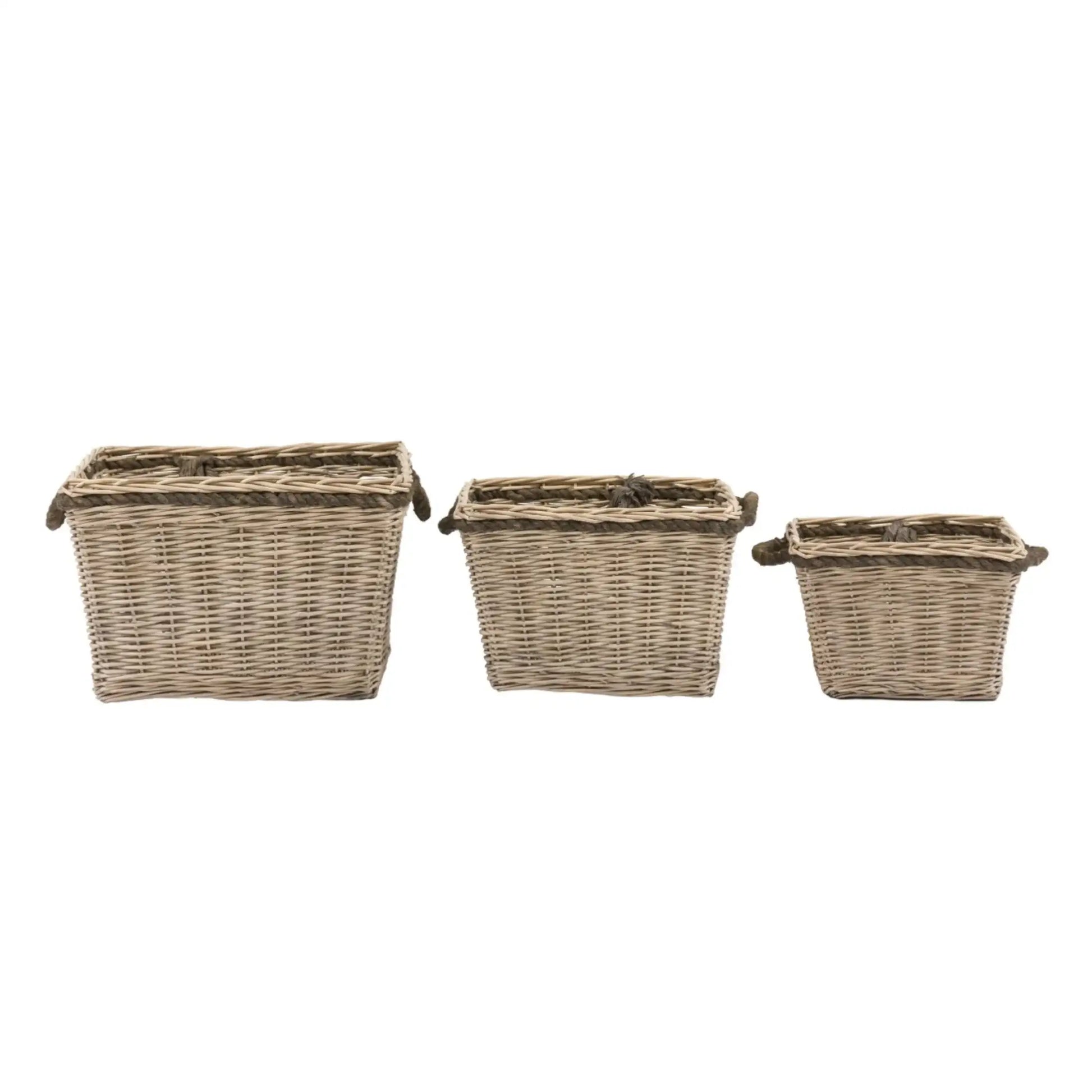 Three wicker baskets of different sizes on a white background