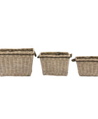 Three wicker baskets of different sizes on a white background
