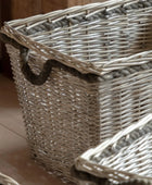 Wicker basket with a rope handle on a wooden surface