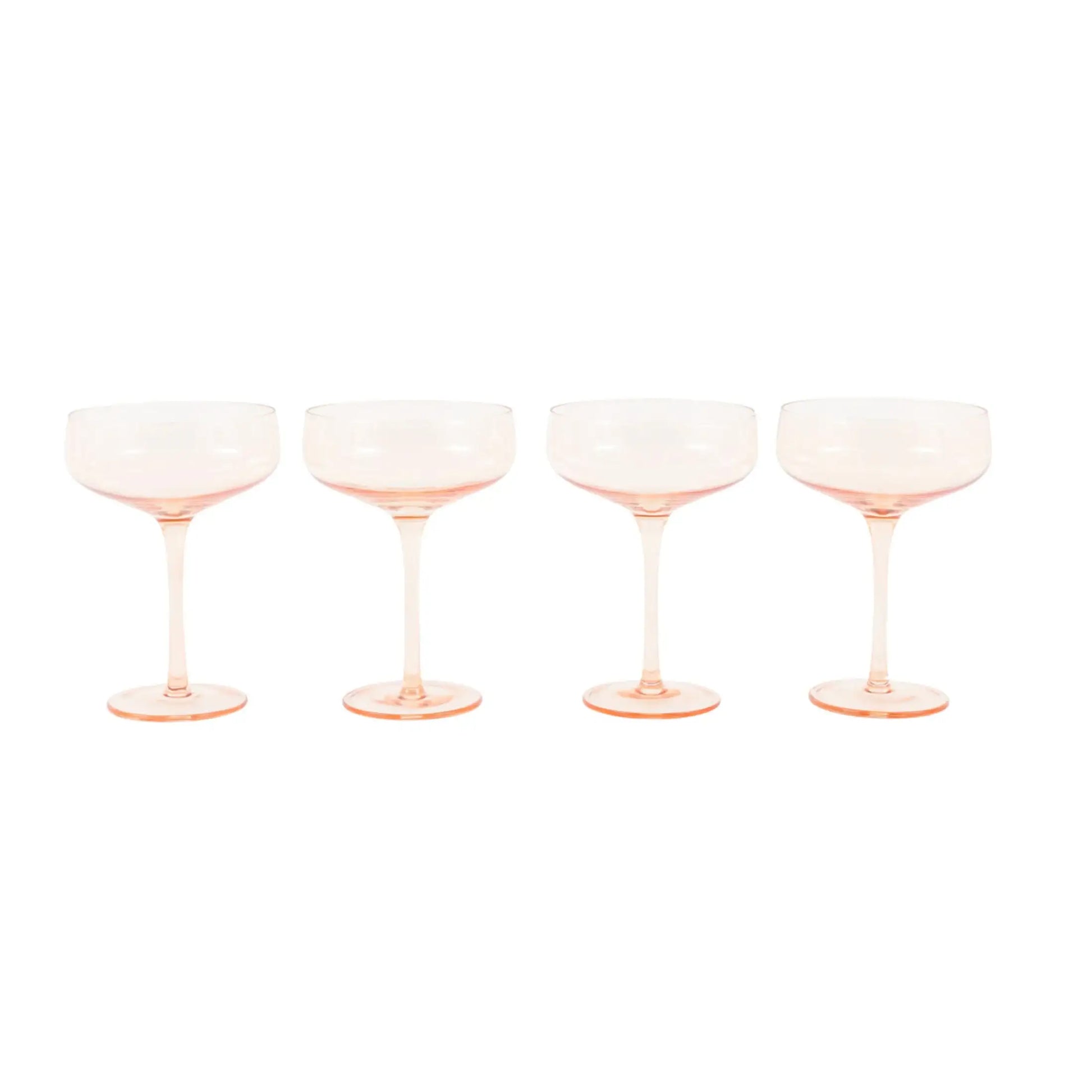 Four pink champagne glasses on a white background