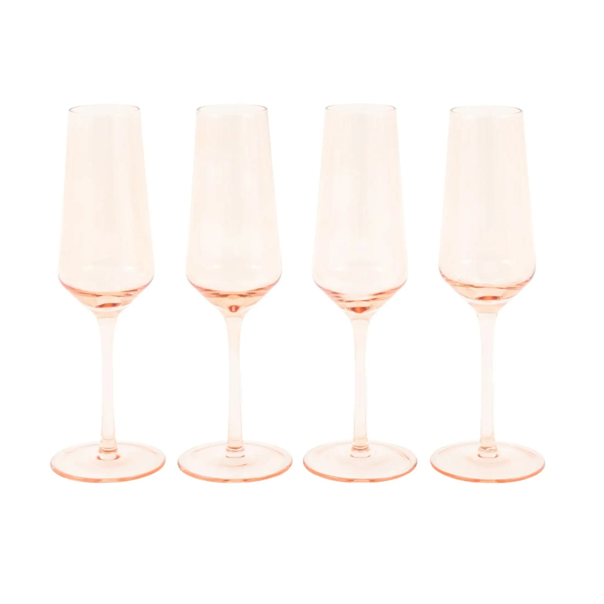 Four pink champagne flutes on a white background