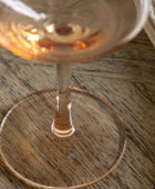Close-up of a glass with a drink on a wooden surface