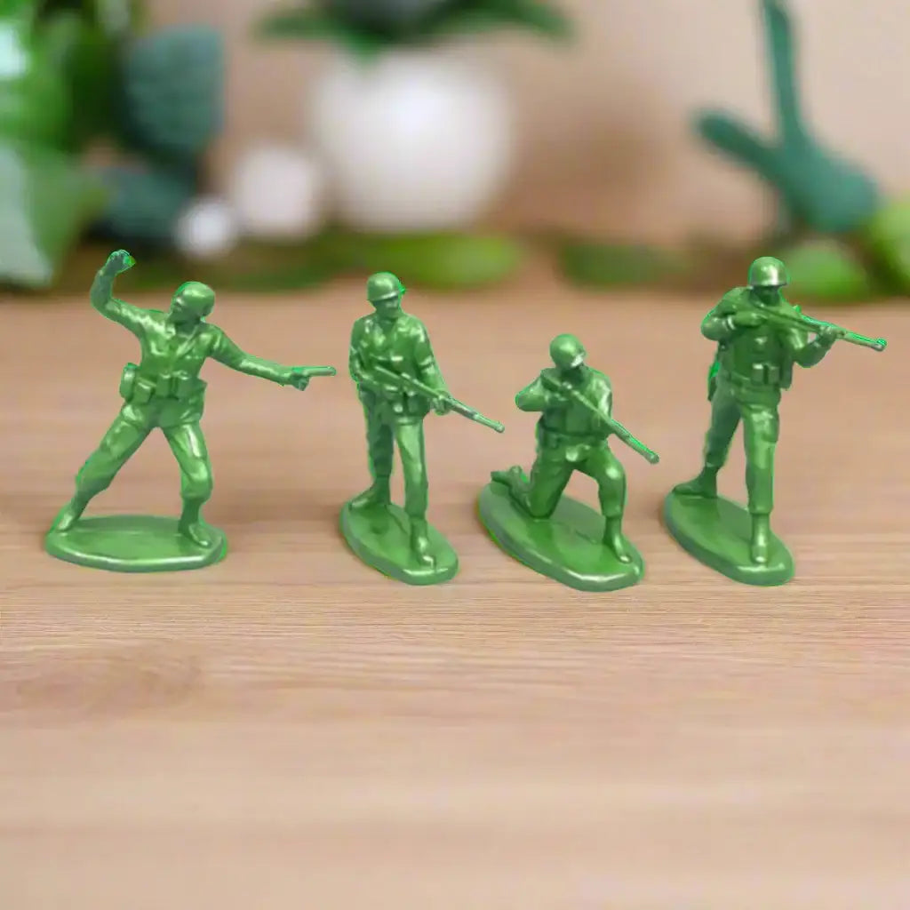 Four green toy soldiers on a white background