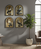 Four framed vintage-style pigeon paintings arranged in a 2x2 grid on a gray wall in a styled living room with a potted fiddle-leaf fig, a chair, and a window.