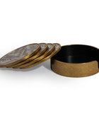 A set of four round coasters with a textured gold-toned outer rim and a silver-toned inner surface featuring a subtle sunburst pattern, shown with one coaster lifted to reveal the interior of the open round box.