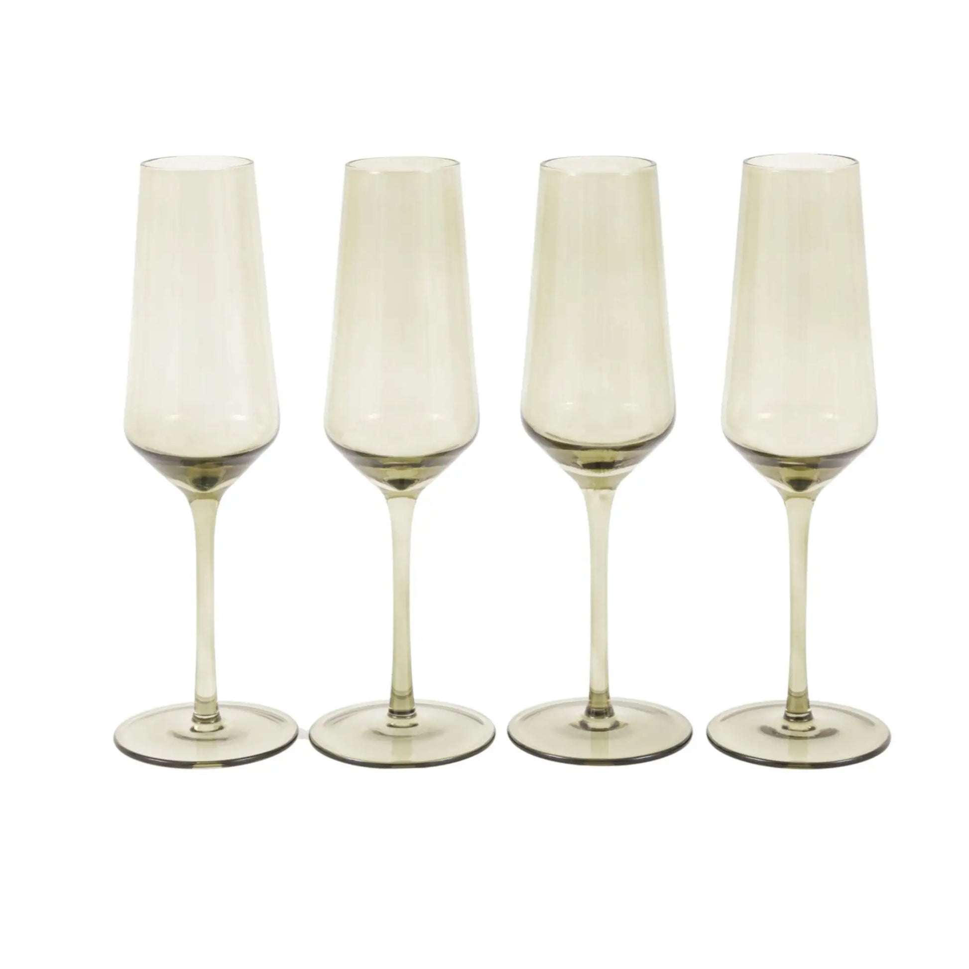 Four champagne flutes with gold bases on a white background
