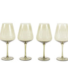 Four white wine glasses with gold stems on a white background