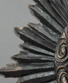 Close-up of a detailed metal gear on a beige background