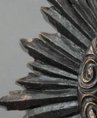 Close-up of a detailed metal gear on a beige background