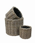 Set of three wicker baskets with a white background