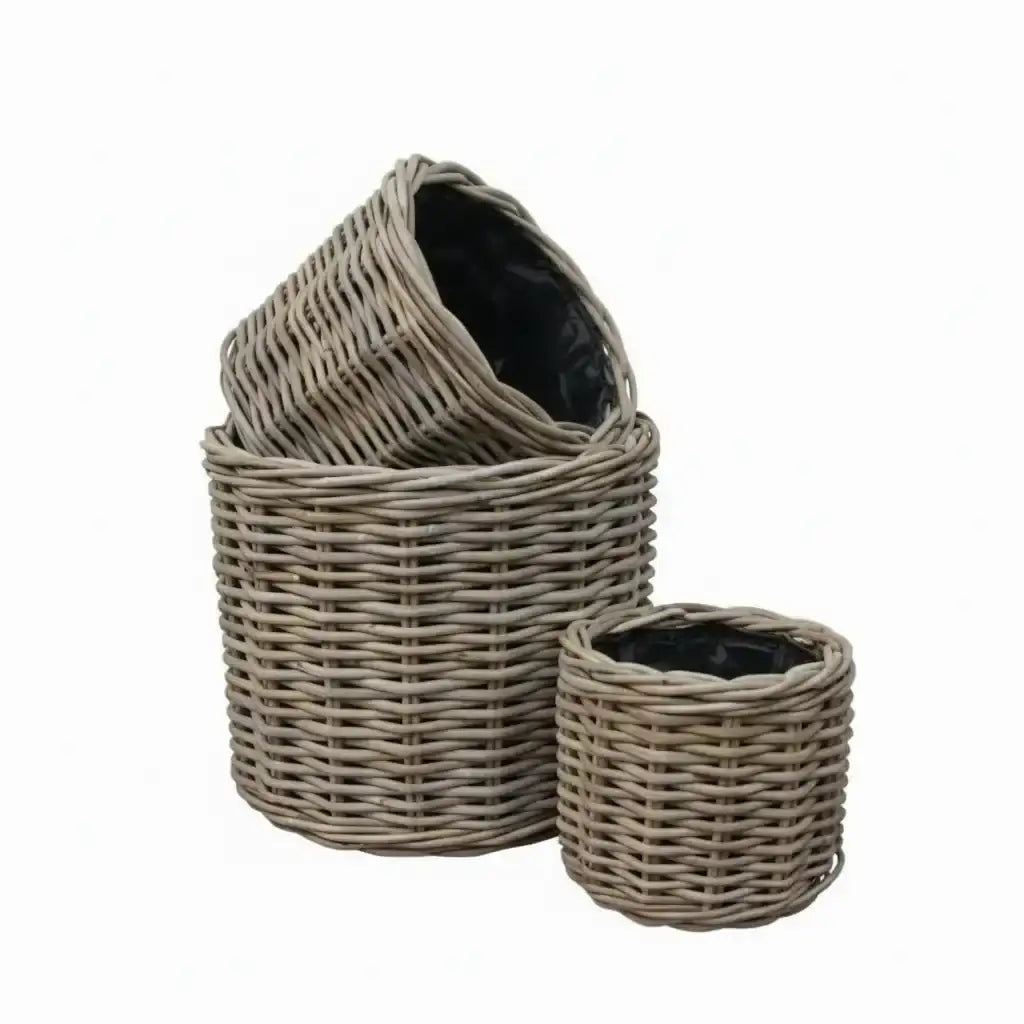 Set of three wicker baskets with a white background
