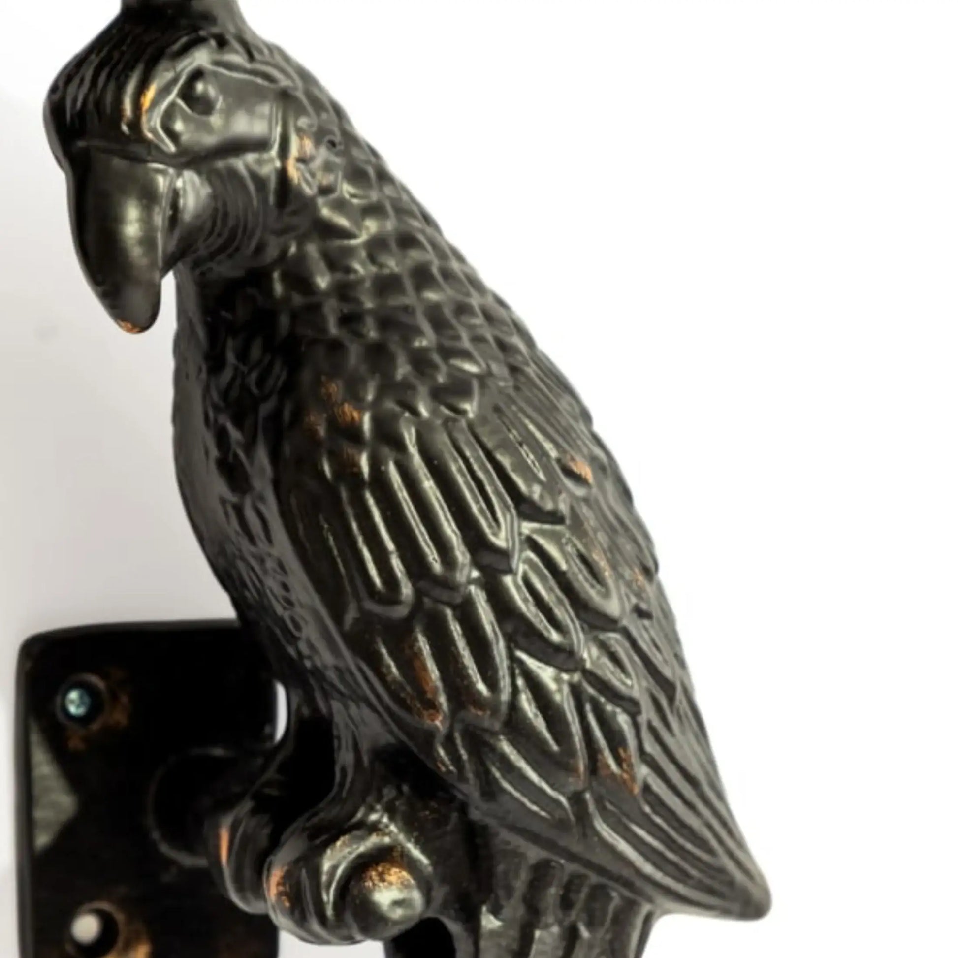 Decorative metal parrot sculpture on a white background
