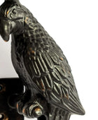 Decorative metal parrot sculpture on a white background