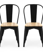 Black metal chair with a wooden seat on a white background