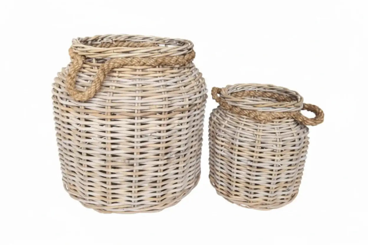 Two wicker baskets with handles on a white background