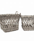 Two wicker baskets with handles on a white background