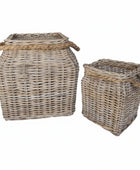 Two wicker baskets with handles on a white background