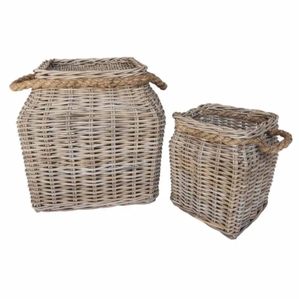 Two wicker baskets with handles on a white background