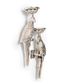 Decorative wall-mounted candle holder with parrot design on a white background