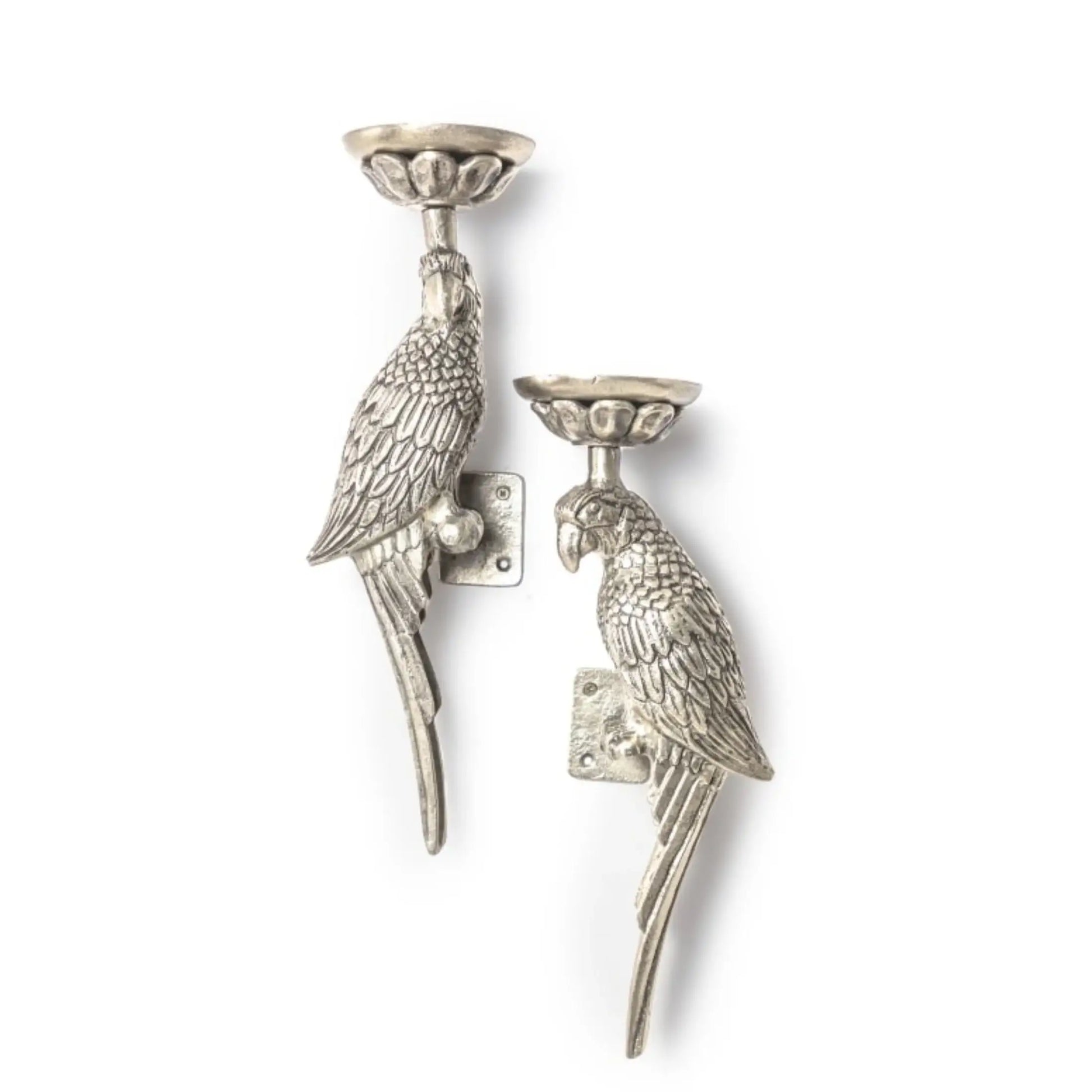 Two silver parrot-shaped candle holders on a white background