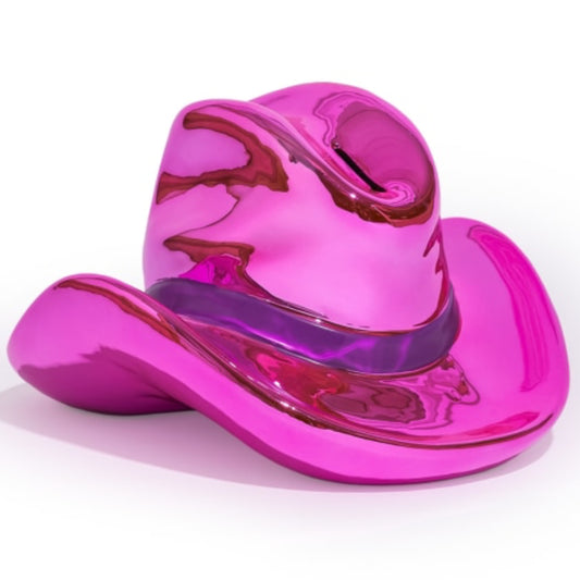 A glossy, metallic pink cowboy hat sculpture or decorative object, shown on a clean white background.