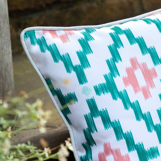 Showerproof Coral & Green Geometric Cushion