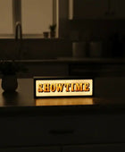 Decorative sign with 'SHOWTIME' on a kitchen counter