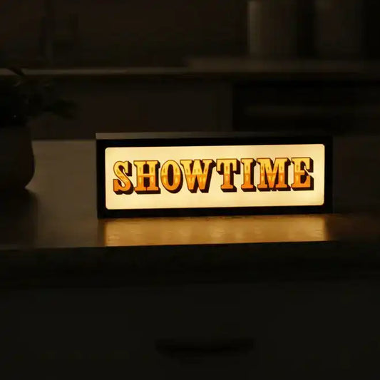 Wooden sign with 'SHOWTIME' on a dark background