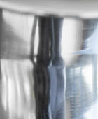 Close-up of a metallic surface with reflections