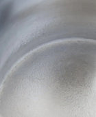 Close-up of a metallic surface with reflections