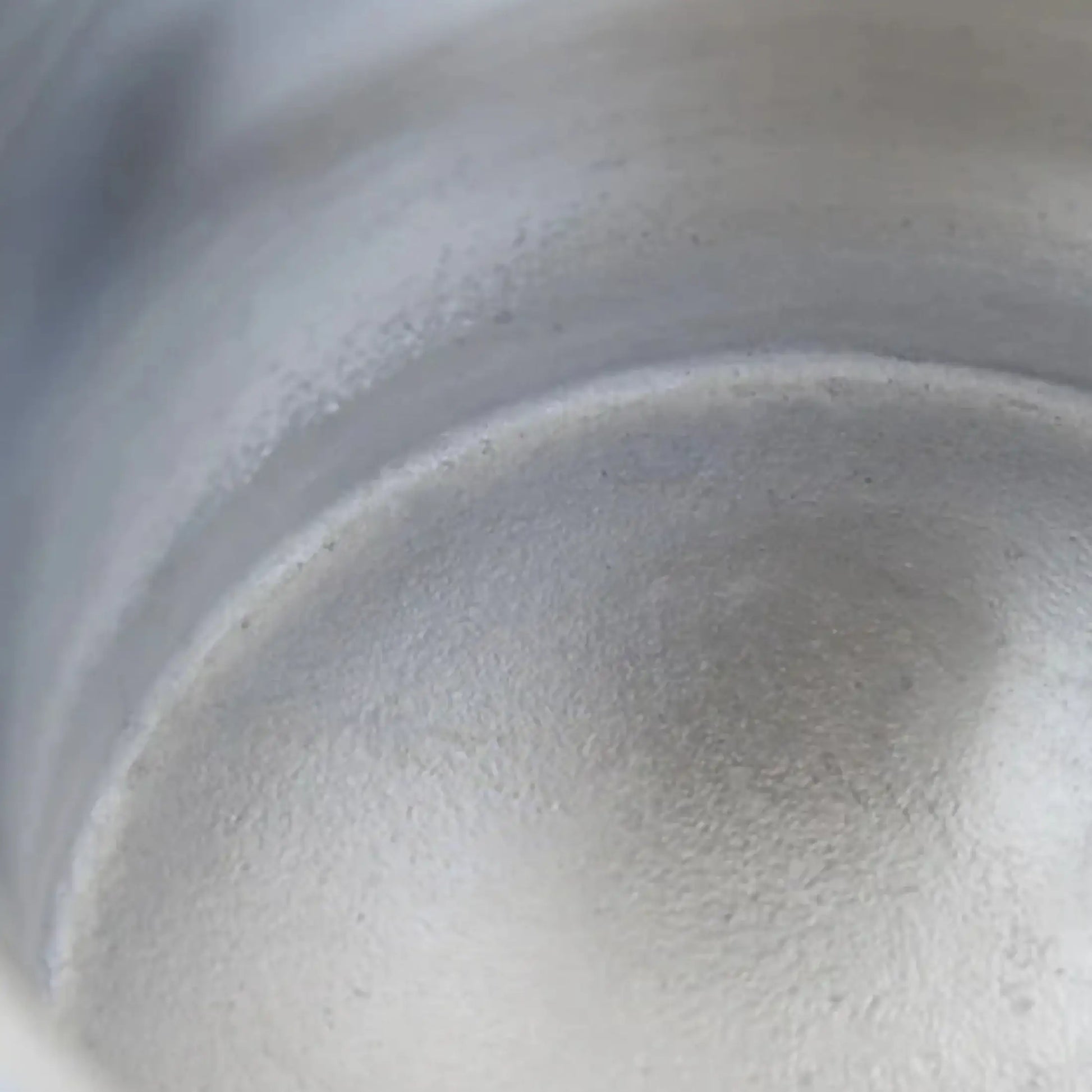 Close-up of a metallic surface with reflections