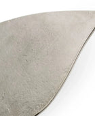 Triangular piece of gray stone on a white background