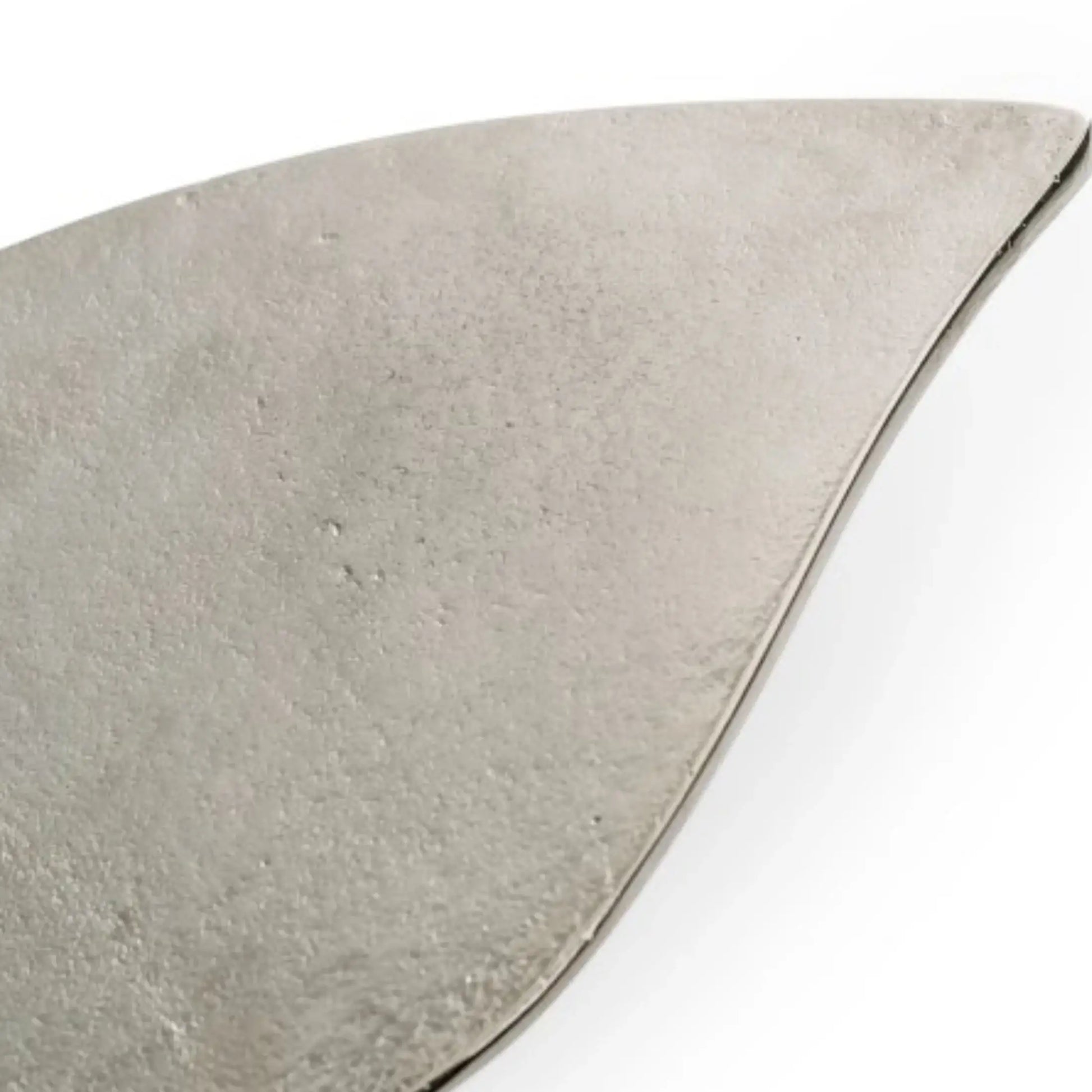 Triangular piece of gray stone on a white background