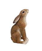 Brown rabbit figurine on a white background