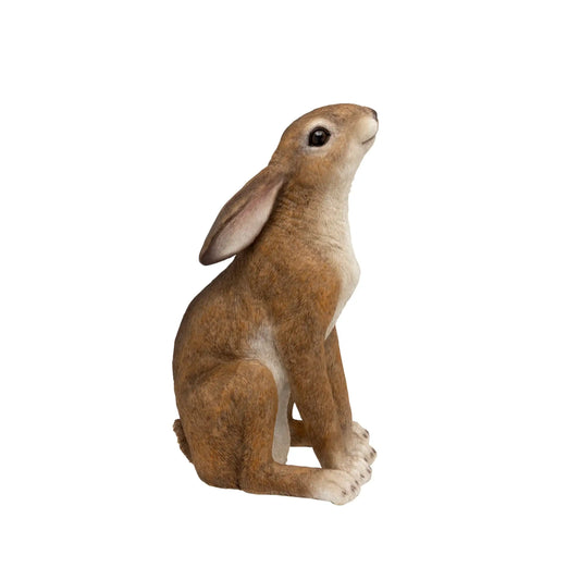 Brown rabbit figurine on a white background