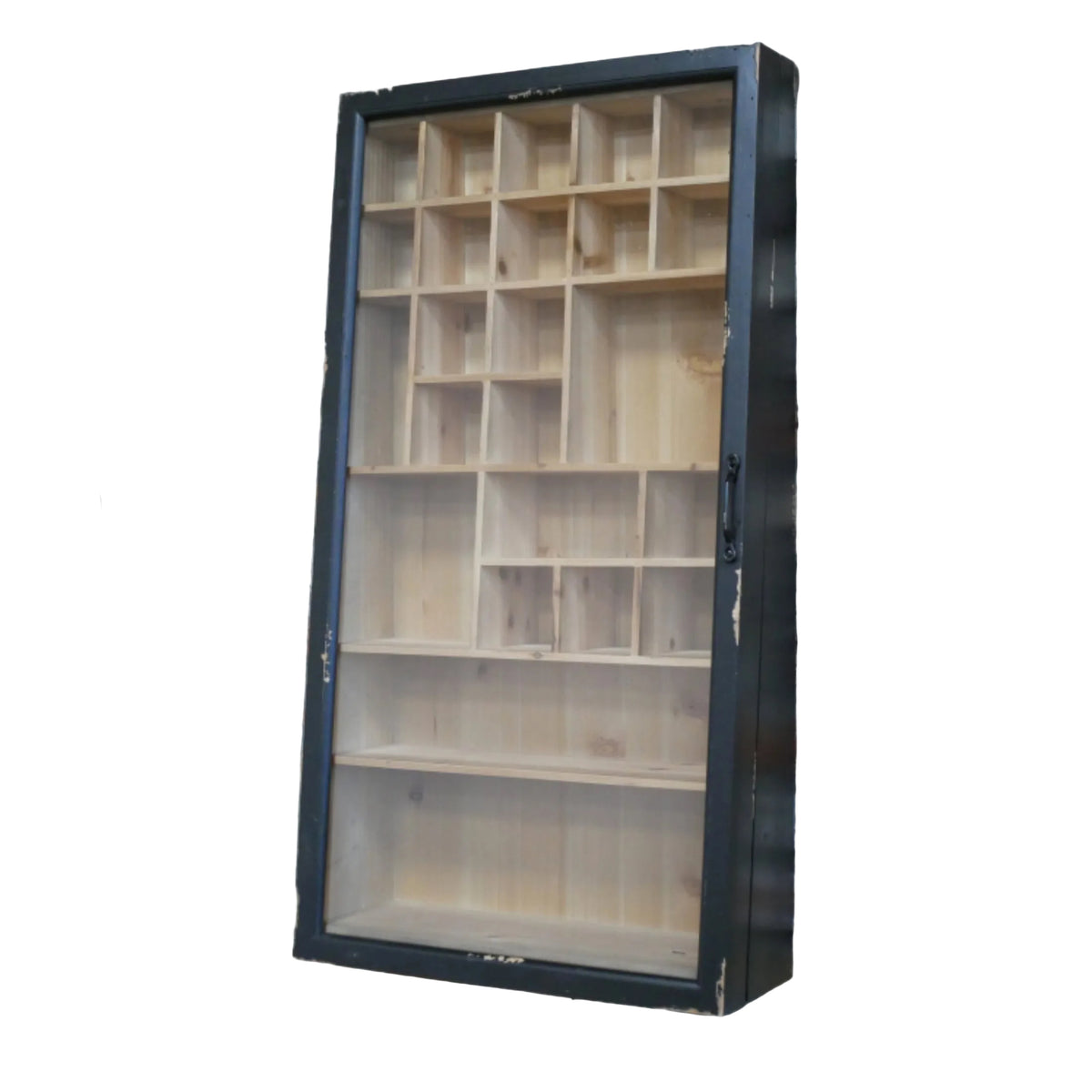 A wall-mounted wooden display cabinet with a black frame and multiple interior compartments, shown against a brick wall.