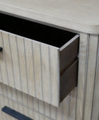 Wooden cabinet with open drawer and black handles