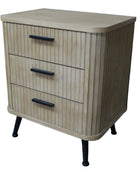 Wooden cabinet with three drawers and black handles on a wooden floor.