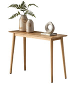 Wooden console table with decorative items on a white background