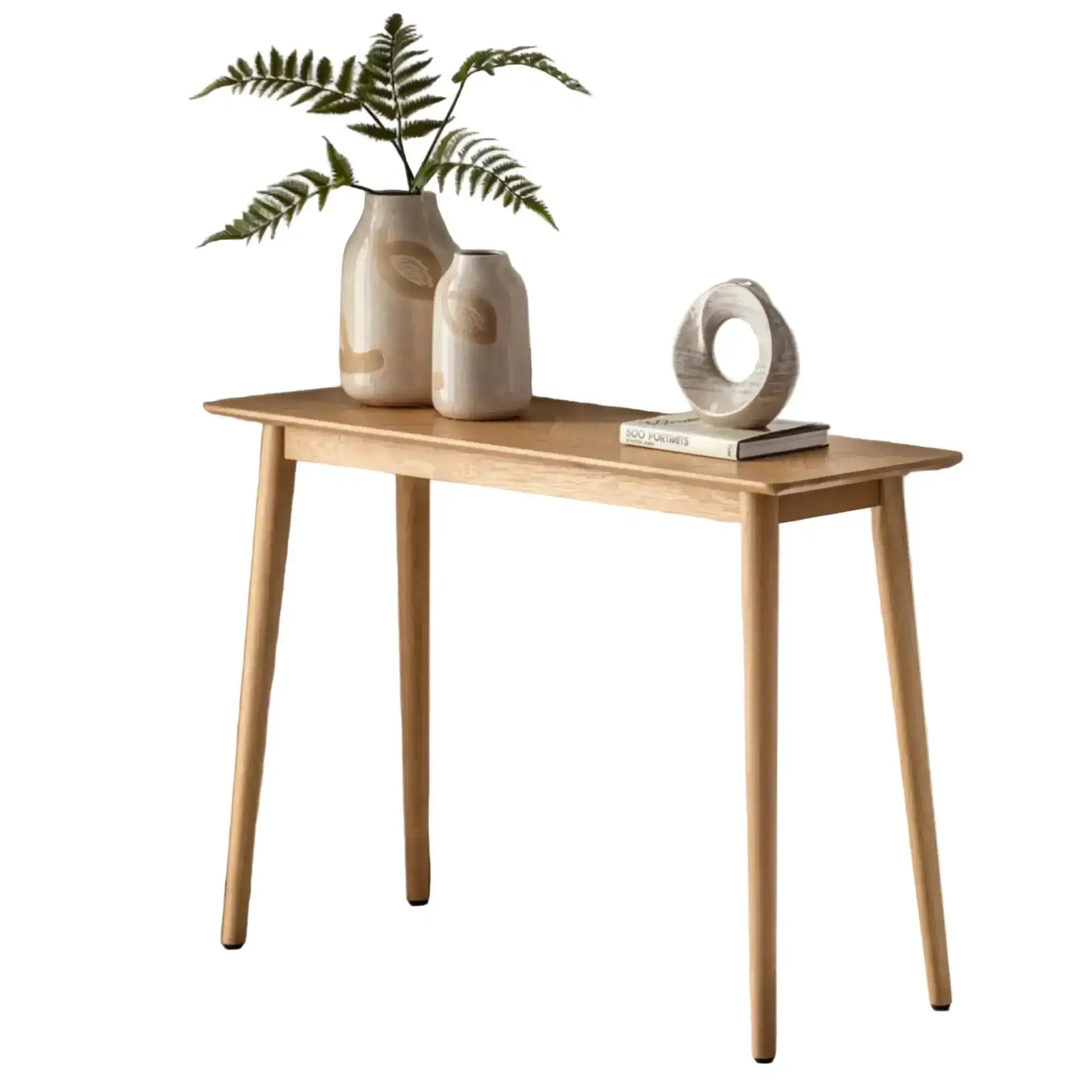 Wooden console table with decorative items on a white background